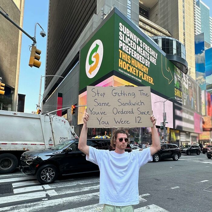 Clever-Dude-With-Sign-Protesting-Annoying-Things