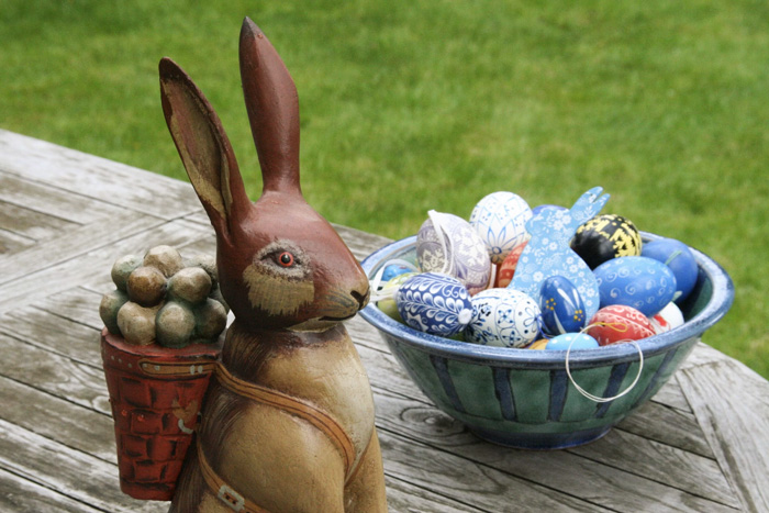 Easter eggs and a rabbit figurine displayed outdoors, illustrating culture facts reflecting diversity and beauty of the world.