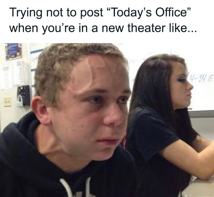 Man struggling not to post about new theater, humorous dance meme expression in a classroom.