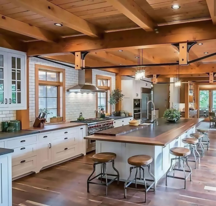 Wooden farmhouse with white wooden kitchen and wooden table with chairs Wooden farmhouse with white wooden kitchen and wooden table with chairs