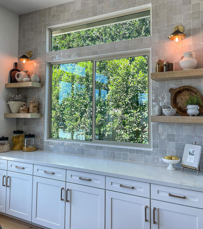 White wooden and marble kitchen with window White wooden and marble kitchen with window