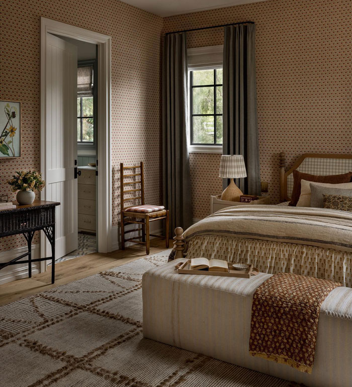 Bedroom with white striped rug wallpaper and bed with sheets Bedroom with white striped rug wallpaper and bed with sheets