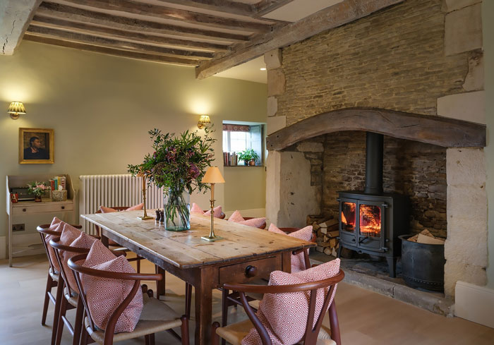 Living room with table and chairs and with fireplace Living room with table and chairs and with fireplace