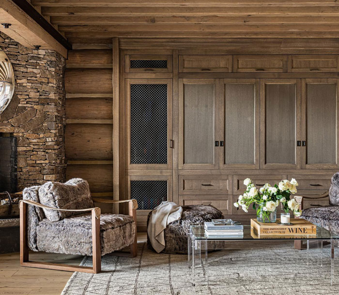 Living room with wooden cupboards stripped rug and furniture Living room with wooden cupboards stripped rug and furniture