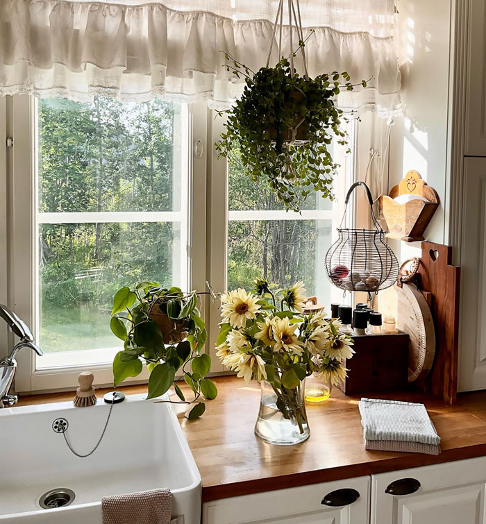 Farmhouse kitchen with flowers and sink Farmhouse kitchen with flowers and sink