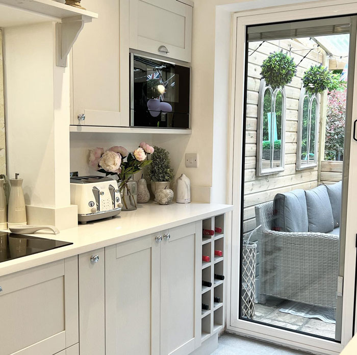 White cupboards with wine bottle rack White cupboards with wine bottle rack