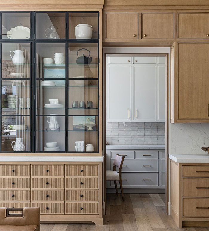 Brown wooden cupboard with dishes Brown wooden cupboard with dishes