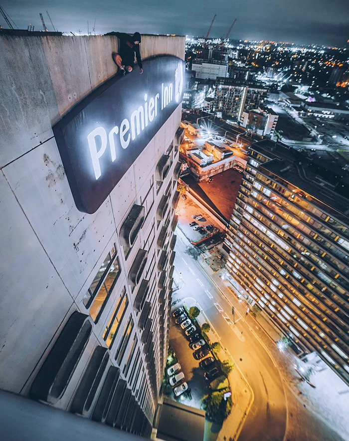 When You Can't Get A Room, So You End Up Sleeping On The Sign Instead