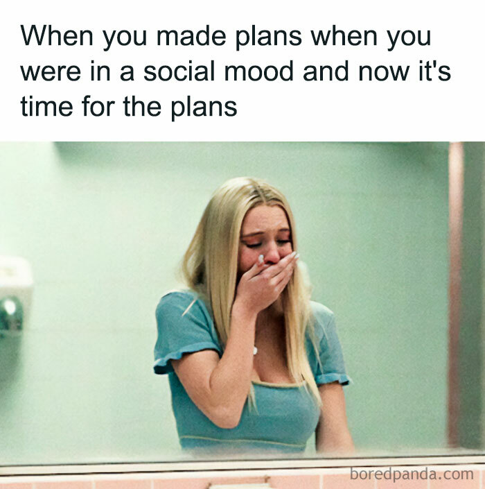 Woman in a light blue top looking regretful about plans, embodying relatable funny memes about women.