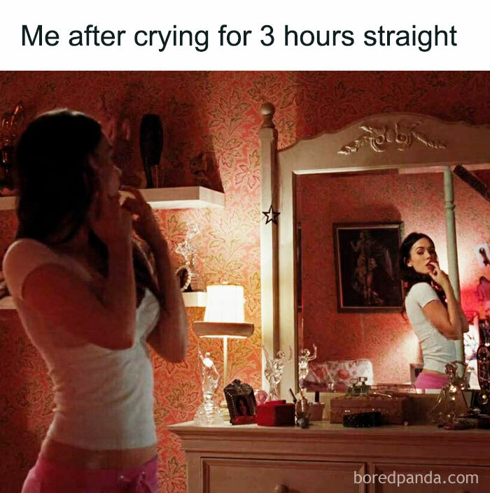 Woman posing in front of a mirror after crying, highlighting a funny meme about women.