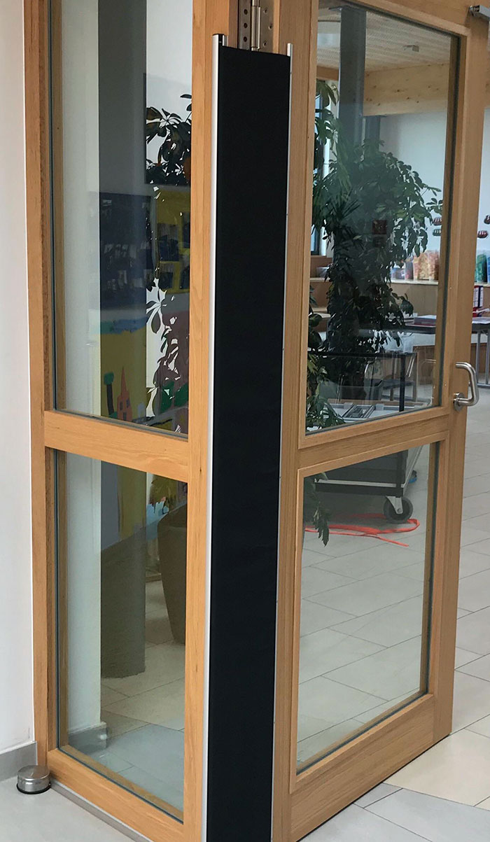 This Cloth Screen Goes Over The Door Hinge, At A Preschool, To Keep Kids From Getting Their Fingers Smashed