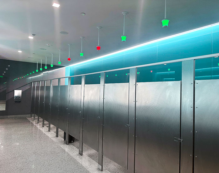 This Airport Bathroom Has Green And Red Lights Above The Stalls To Show Which Ones Are Occupied