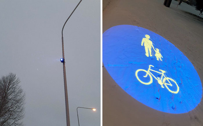 This Light Attached To The Lamp-Post Projects A Picture On The Ground To Show Where The Sidewalk Is In Case Of Snowfall