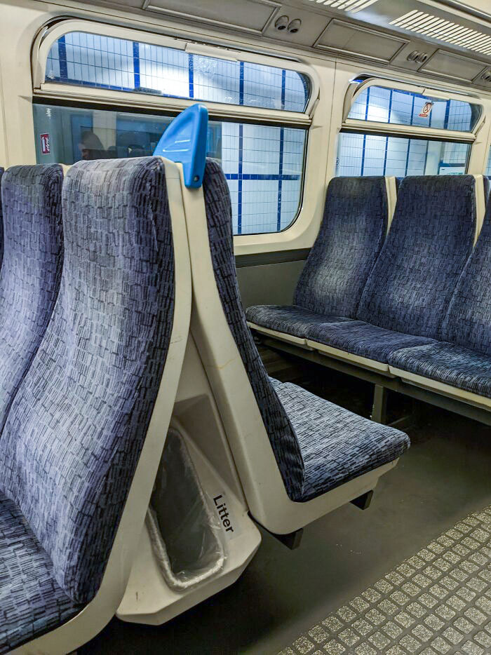 This Train Uses The Space Between Seats For Garbage