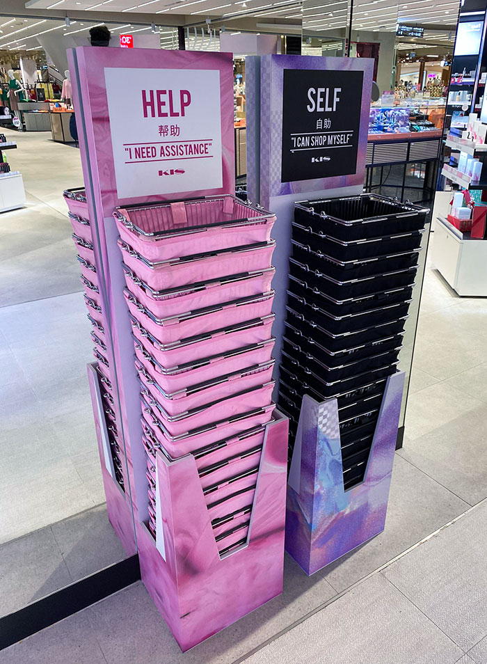 These Two Different Sets Of Shopping Baskets At A Department Store In Bangkok. For Those That Need Help And Those That Want To Be Left Alone