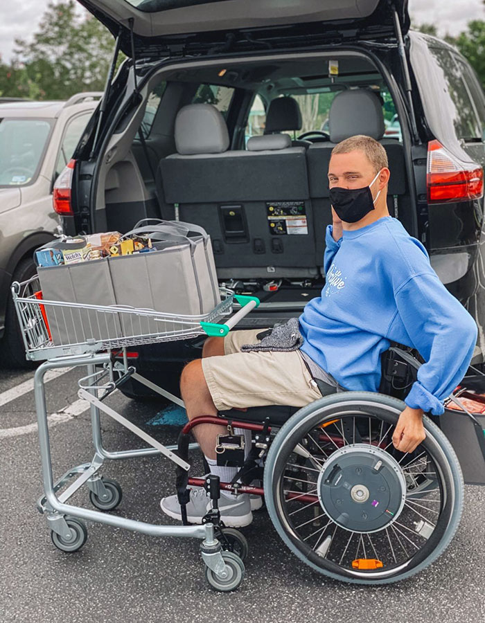 A Grocery Cart That Attaches To A Wheelchair To Provide Greater Independence While Shopping