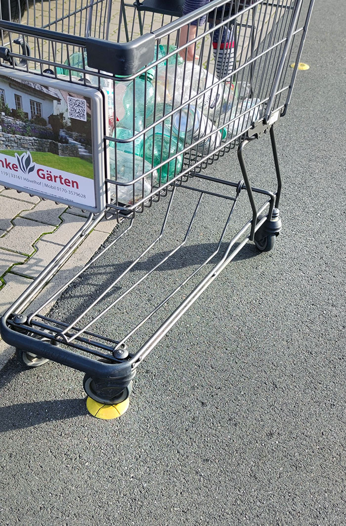 My Local Supermarket Has These Yellow Sockets So The Shopping Cart Doesn't Roll Away When Stowing Your Shopping Into Your Car