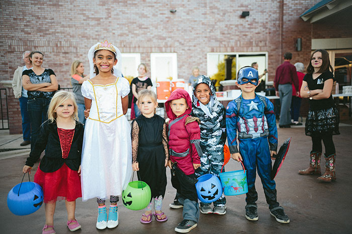 Childrens wearing Halloween costumes