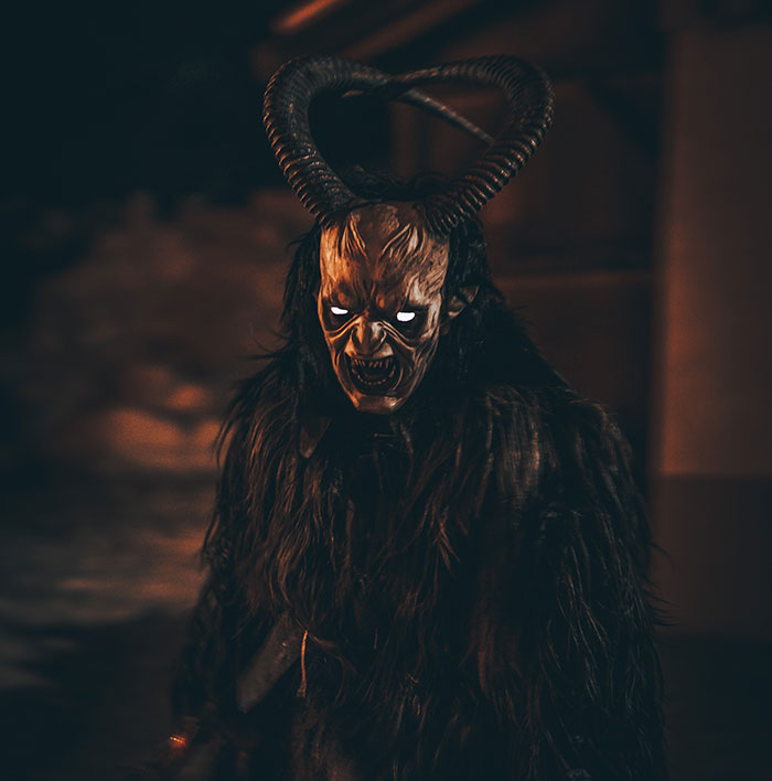 Man wearing devil costume