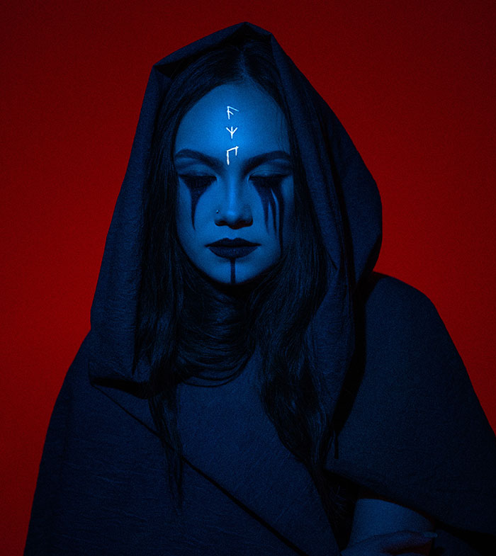 Woman wearing witch costume