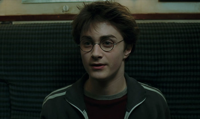 Harry Potter sitting on the sofa