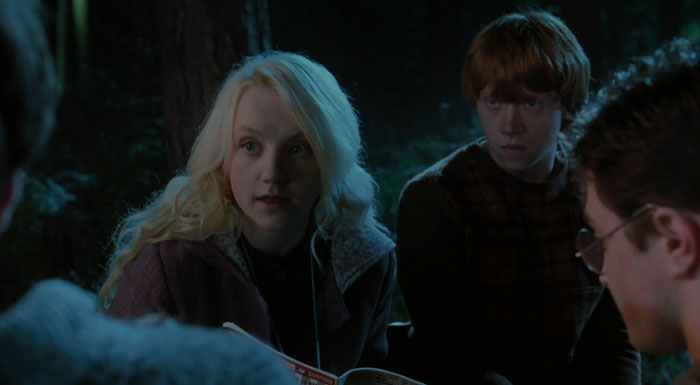 Luna Lovegood staying near Ron and explaining something