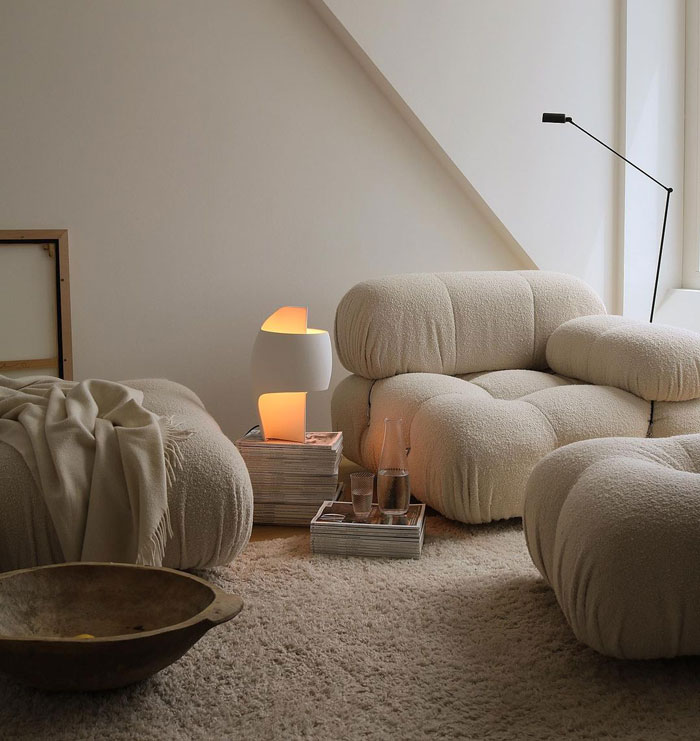 Cozy living room ideas featuring white armchairs, soft lighting, and textured rugs for a warm interior refresh.