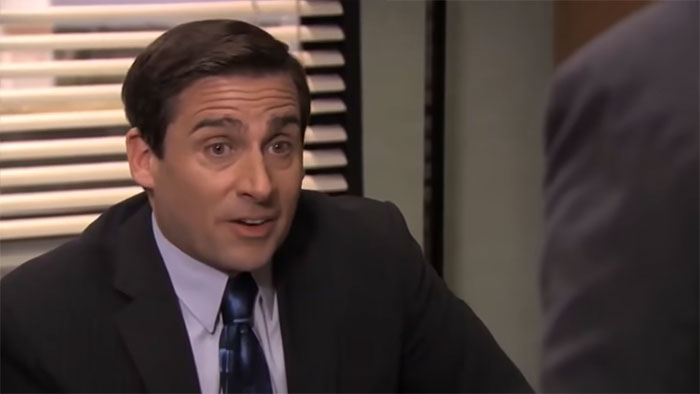 Michael Scott talking in an office setting, illustrating leadership qualities highlighted in best boss quotes.