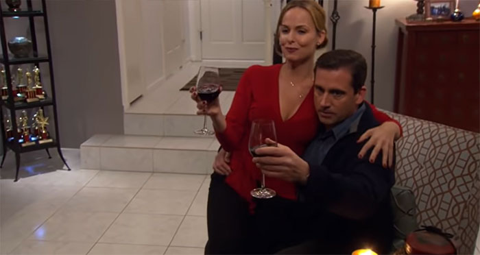 Michael Scott and Jan Levinson drinking wine together, showcasing a memorable moment of the best boss ever.
