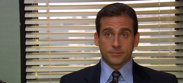 Michael Scott sitting near a window, speaking thoughtfully in a scene highlighting best boss quotes.