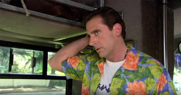 Michael Scott at the bus wearing a colorful floral shirt, showcasing his quirky personality and best boss vibe.