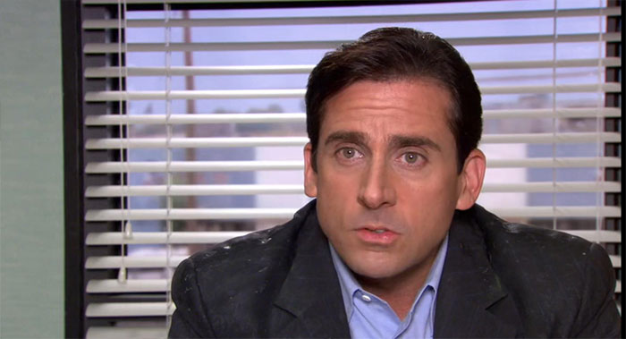 Michael Scott speaking in an office setting, embodying the qualities of the best boss ever with memorable quotes.