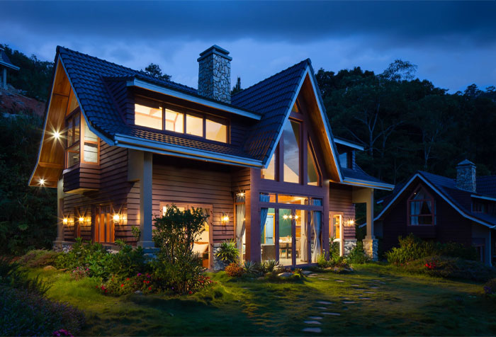brown and black wooden house with lights and flowers brown and black wooden house with lights and flowers