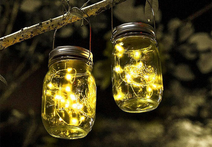 Mason jars with lights hanging on tree Mason jars with lights hanging on tree