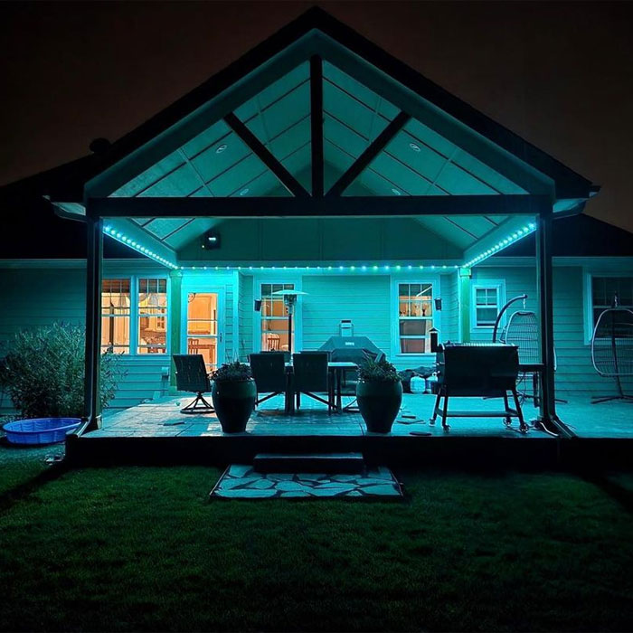 House porch with furniture flowers and Govee lights House porch with furniture flowers and Govee lights