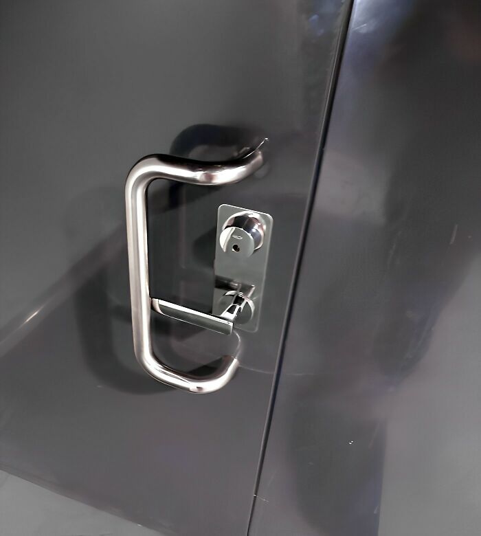 The Smaller Door Handle Needs To Be Pressed Down For The Door To Open