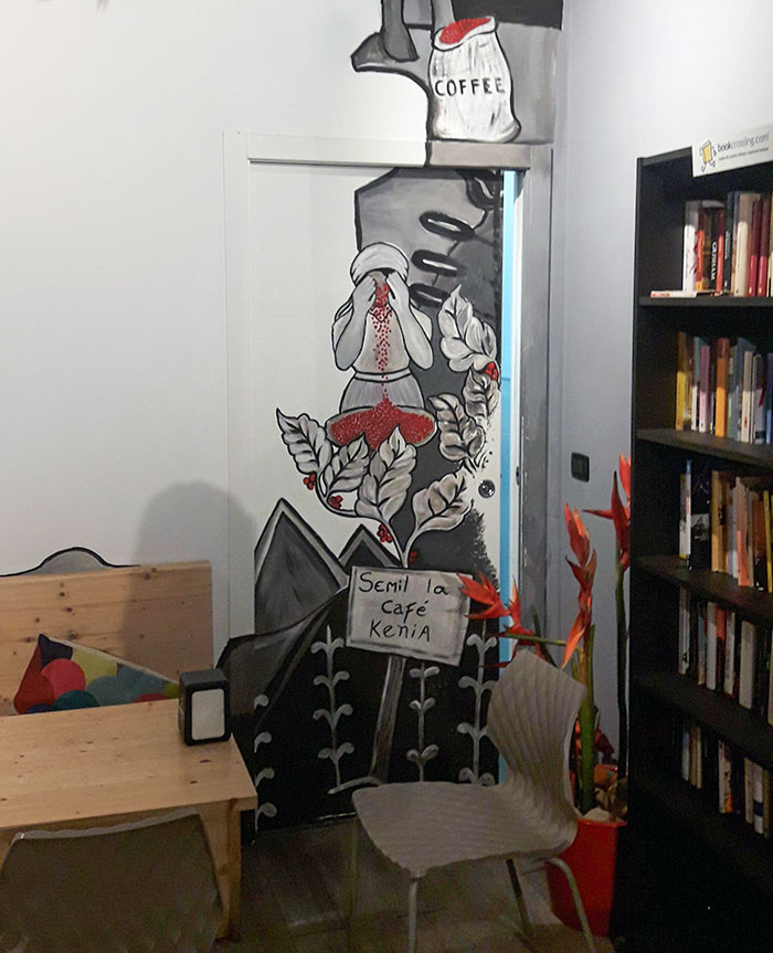 This Drawing At The Bar. I Think She Is Supposed To Smell Fresh Coffee Seeds, But It Looks Like She's Crying Blood