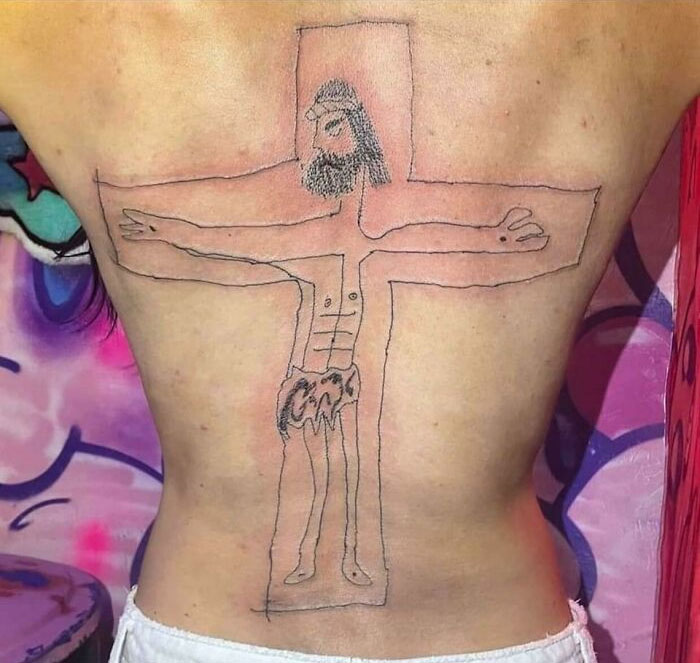 Crude tattoo of a stick-figure Jesus on a person's back, highlighting unskilled tattoo artistry.
