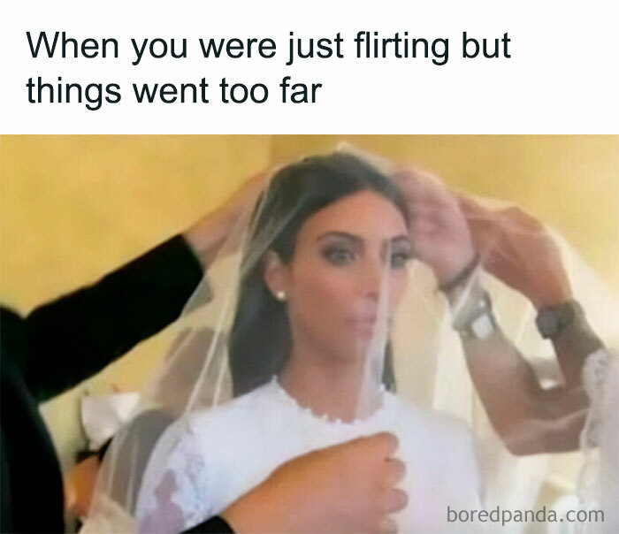 Bride in wedding dress with caption about life, looking surprised as veil is adjusted.