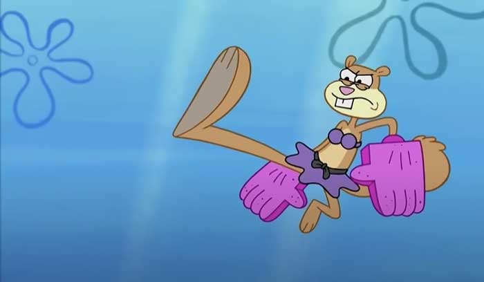 Sandy Cheeks performing a karate chop underwater, showcasing strength and determination in iconic SpongeBob quotes.