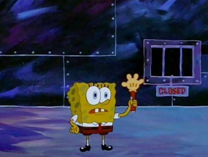 SpongeBob holding up a hand-shaped torch in a dark room, illustrating a moment from iconic SpongeBob quotes.