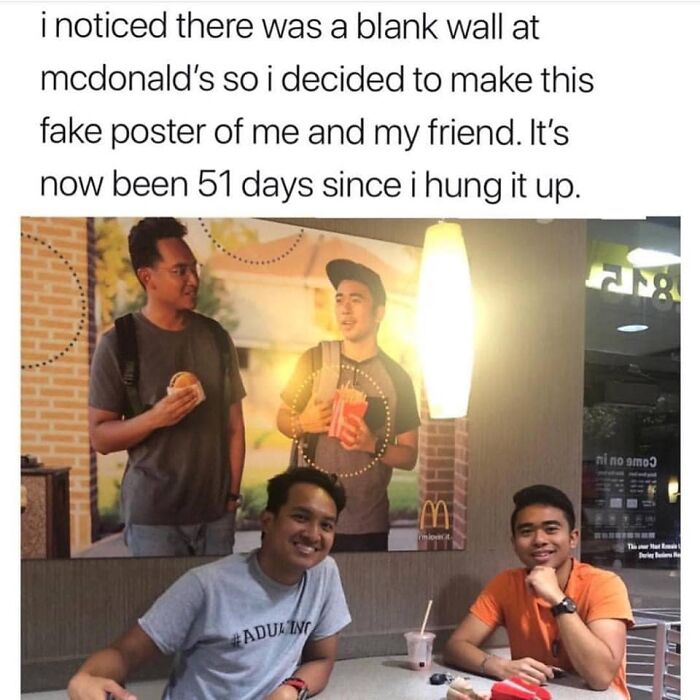 Funny pic of friends posing at McDonald's with a fake poster of themselves in the background for a laugh.