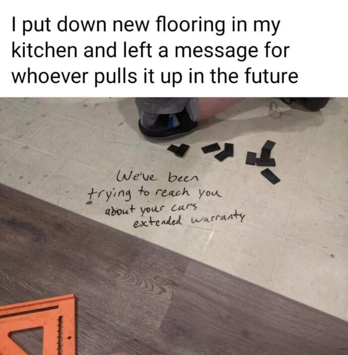 Funny pic: Message under flooring about car's extended warranty, person kneeling nearby.