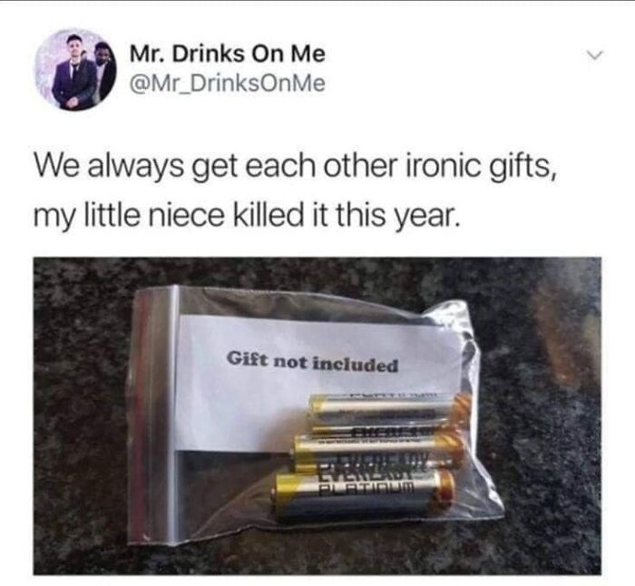 Ironic gift with batteries in a bag labeled "Gift not included," for a humorous laugh.