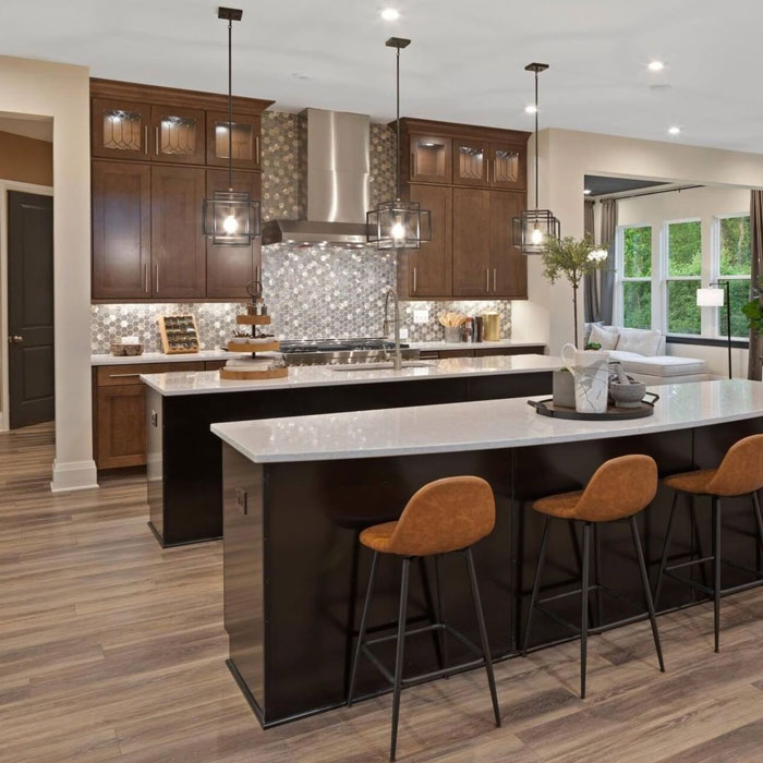 two kitchen islands and three bar chairs under a second kitchen island two kitchen islands and three bar chairs under a second kitchen island