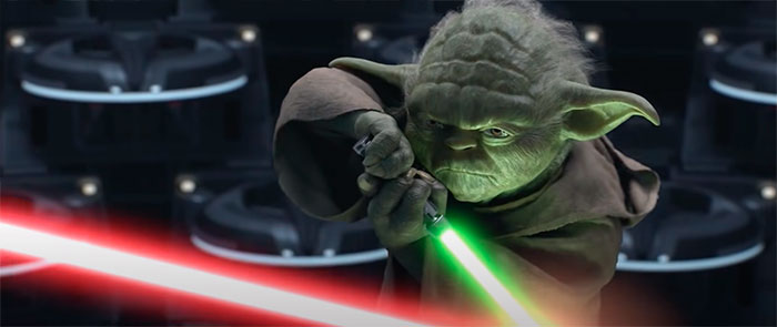Yoda holding a lightsaber chopstick