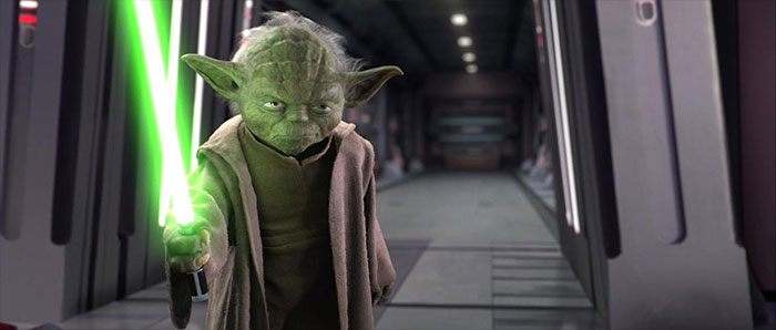 Yoda holding lightsaber chopstick