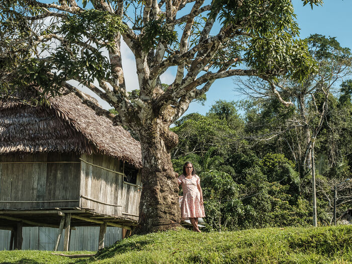 A woman stands on the shore of the Amazon River A woman stands on the shore of the Amazon River