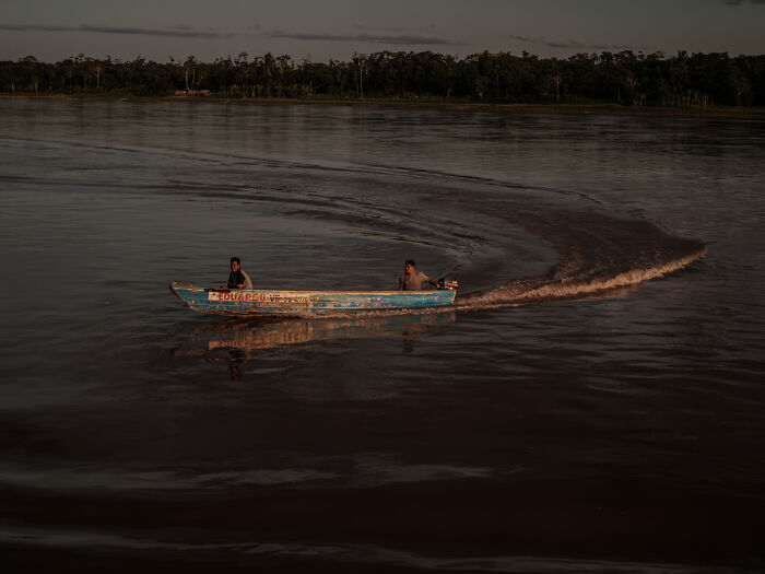 The small boat regularly inspects the waters ahead of Eduardo 7 to make sure the river is deep enough for the cargo ship The small boat regularly inspects the waters ahead of Eduardo 7 to make sure the river is deep enough for the cargo ship