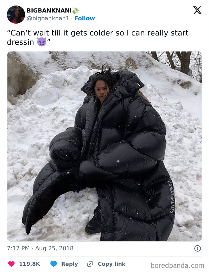 Person wearing oversized black coat in snowy weather, showcasing a humorous winter meme.